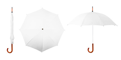Set of white umbrellas isolated on white background. Collection of blank folded, closed, open umbrellas on white background. Side view. Top view © Dmitry Zimin
