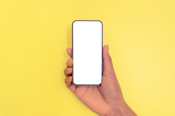 Fototapeta na wymiar Human hand holding smartphone with white screen background.
