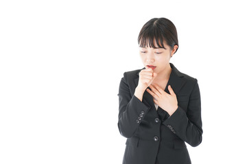 風邪をひいた若いビジネスウーマン