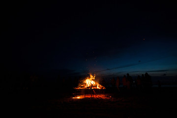 Ignite the fire. Warming up the cold winter nights. A macro shot of firewood, white dust and hot,...