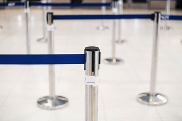 Barricade lines to people to queue up the line of service