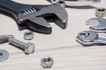 adjustable spanners and wrenches, nuts and bolts on the table