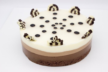 Chocolate cake. Cake of several varieties of chocolate: black, milk and white.
