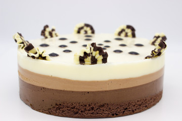 Chocolate cake. Cake of several varieties of chocolate: black, milk and white.