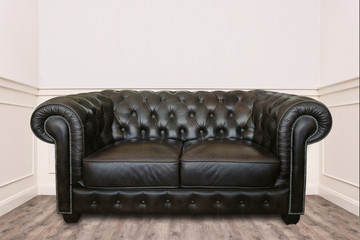 Leather sofa in a small cozy room clean and minimal