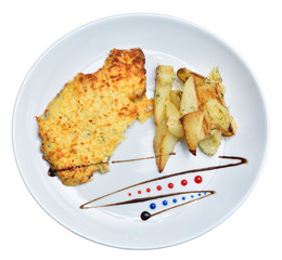 White round plate on a white background with baked meat and cheese and potatoes, decorated with sauce. Isolated
