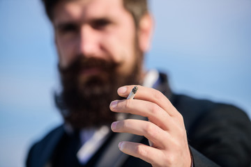 I quit smoking. Blurred usinessman against the sky. Future success. Male formal fashion. Bearded man smoking cigarette. smoke. brutal caucasian hipster with moustache. Mature hipster with beard