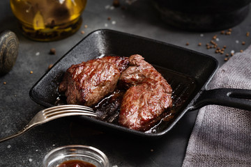 Grilled meat Steak Machete with salt and pepper on slate board black background