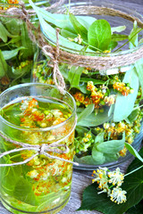 Linden flowers in a glass jar. Harvesting of linden tea. Linden tea. Healing herbal tea.
