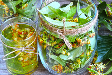 Linden flowers in a glass jar. Harvesting of linden tea. Linden tea. Healing herbal tea.