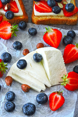 White cheese, strawberries, blueberries, nuts. Keto diet. Keto lunch idea. 