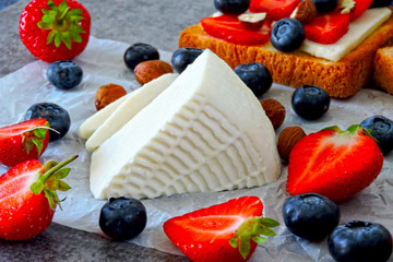 White cheese, strawberries, blueberries, nuts. Keto diet. Keto lunch idea. 
