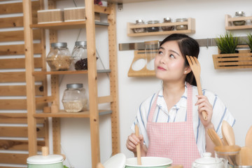 Young smiling Woman Cooking in the kitchen. Homemade Food . Diet. Dieting Concept. Healthy Lifestyle. Cooking At Home. Prepare Food