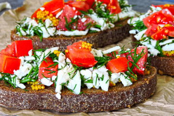 Toast with white cheese, herbs and garlic. Toasts of rye bread with white cheese and garlic. 