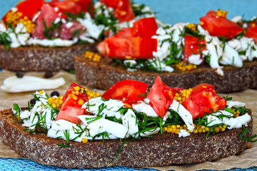 Toast with white cheese, herbs and garlic. Toasts of rye bread with white cheese and garlic. 