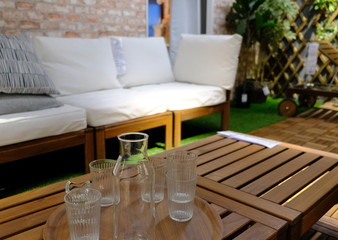 glasses on a table and a bench