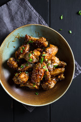Teriyaki chicken wings with sesame and green onions