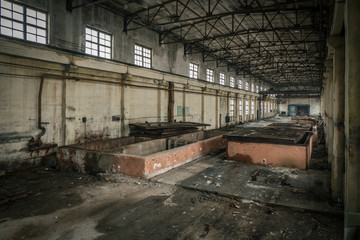 Abandoned industrial building interior. Former reinforced concrete factory