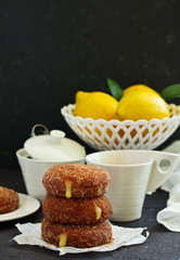 Donuts with cinnamon and lemon cream. Homemade baking. Selective focus.
