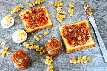 Toast with homemade currant jam. Freshly made jam from white currant. White currant. Useful sweets. Delicious croutons with white-currant jam.