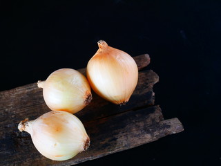 organic onion on black background