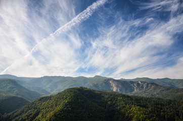 Obraz premium Spring time panoramic landscape from Rhodope mountain, Bulgaria. Blue sky with white clouds