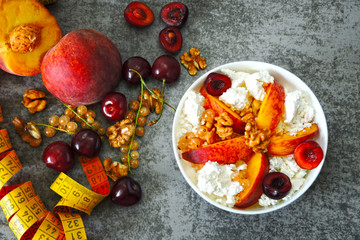 Healthy breakfast or snack curd with fruit and nuts. The concept of nutrition for weight loss. Keto breakfast. Keto lunch idea. 