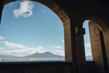 Vesuvius and the gulf of Napoli panoramic view through the castle Castel dell'Ovo arches