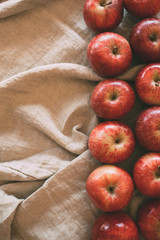Red apples background. Ripe fresh apples in top view with copy space. 