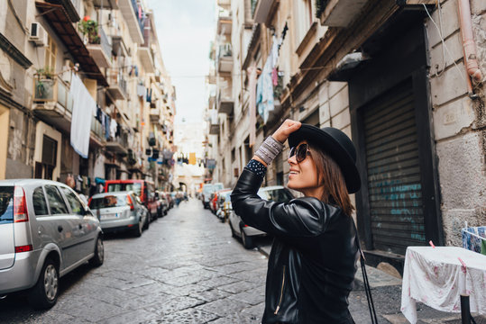 Fototapeta Traveler girl walking by the streets of Naples