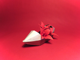 Boat sampan with red flowers on a red background