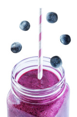 Blueberry banana smoothie on a white background