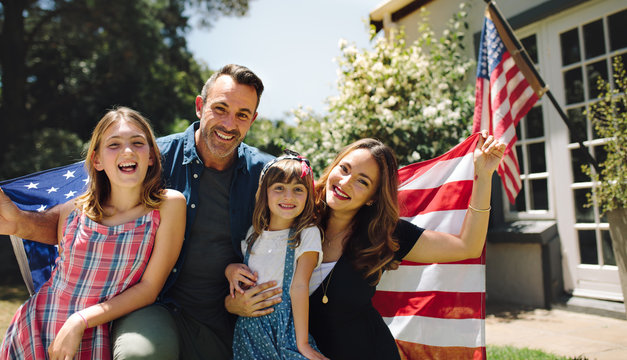 Happy Family Celebrating The American Independence Day