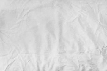 the texture of the white sheets, crumpled white cloth