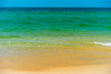 Fototapeta na wymiar Tropical beach with turquoise water and white sand