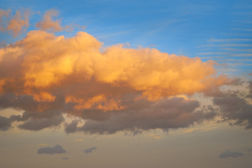 Sunset clouds in orange and blue sky