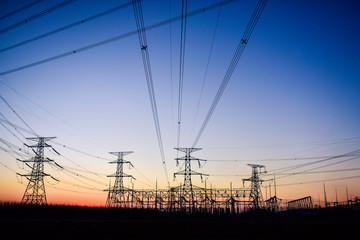 Fototapeta premium In the evening, the outline of the transmission tower