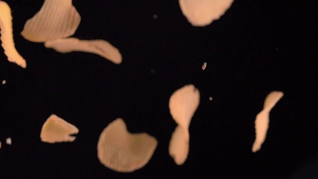 Potato chips flying down.