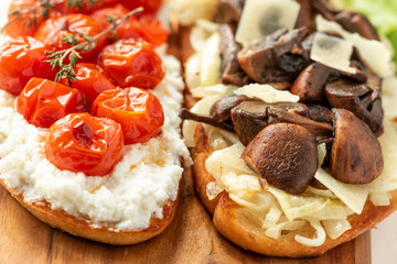 Bruschetta with tomatoes and mushrooms, italian food.