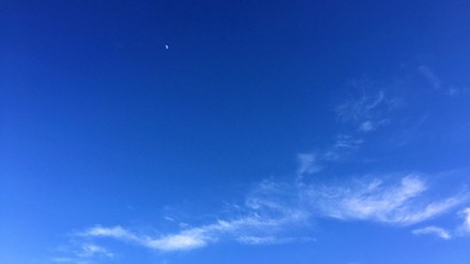 Clear Blue Sky with few Wispy Clouds