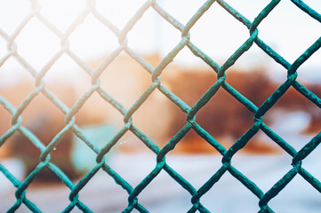 Texture the old cage metal net against sad moody background. Concept of prohibitions and obstacles in the vision of man