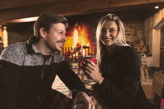 Man and woman drinking tea in cozy place