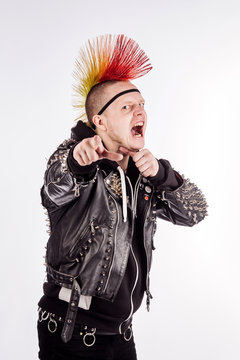Portrait of punk rocker with Mohawk hairstyle on a white background.