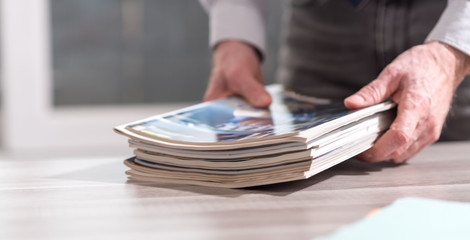 Man holding magazines