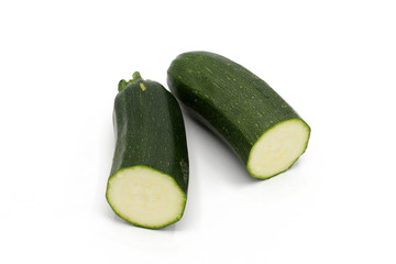 half fresh zucchini - isolated on white
