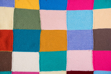 Multicolored patchwork knitted background - obrazy, fototapety, plakaty