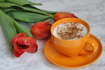 cup of coffee and beautiful tulips