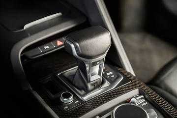Obraz na płótnie Canvas Close up of gear stick in automatic car interior