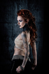  Young tattooed woman, profile