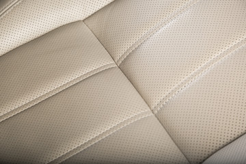 Close up of white leather car seat